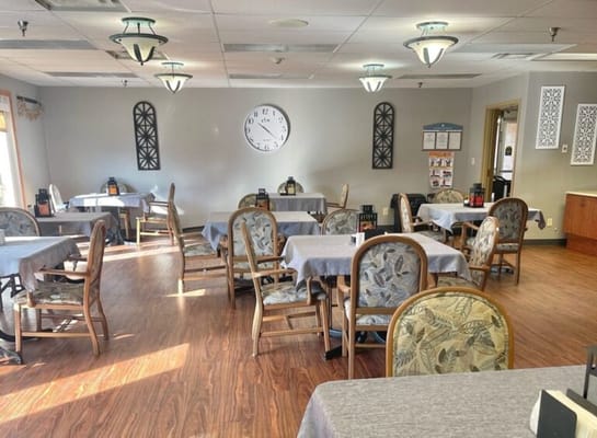 Dining room with tables set and wooden flooring