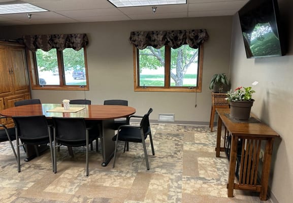 Cozy activity room with a round table and chairs