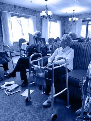 Residents engaging in conversation in a cozy lounge