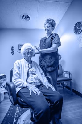 Resident receiving care in a salon setting