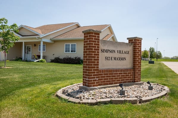 Exterior view of Simpson Village with building signage