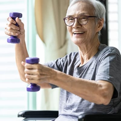Senior man exercising with dumbbells