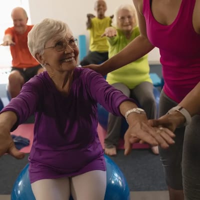 Seniors participating in a group exercise class