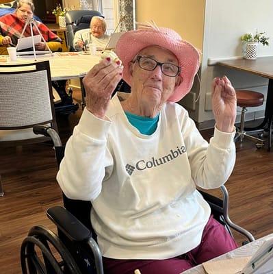 Resident enjoying a cupcake in a common area