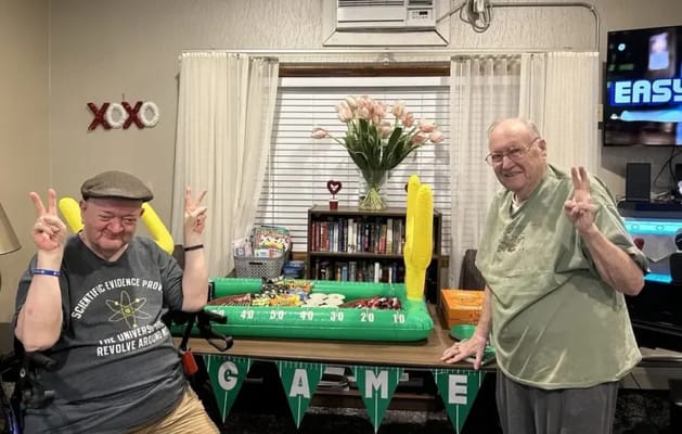 Residents enjoying a game with inflatable decorations