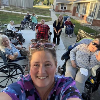 Residents and staff enjoying outdoor time together