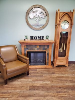 Cozy interior lounge area with fireplace and clock