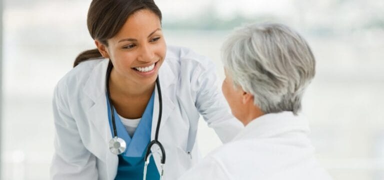 Healthcare professional assisting a senior resident