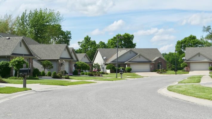 A residential street in a green neighborhood