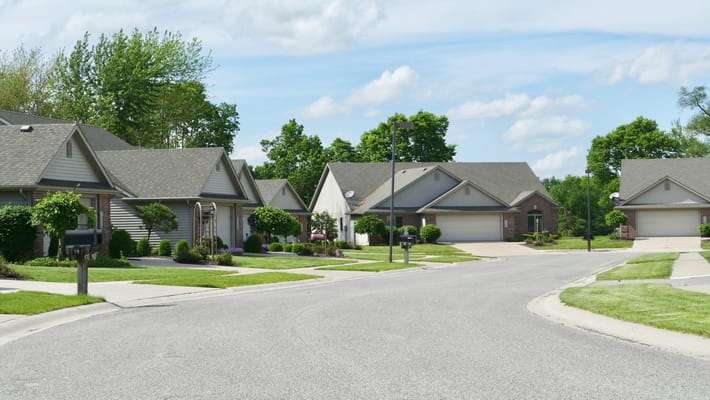 A residential street in a green neighborhood