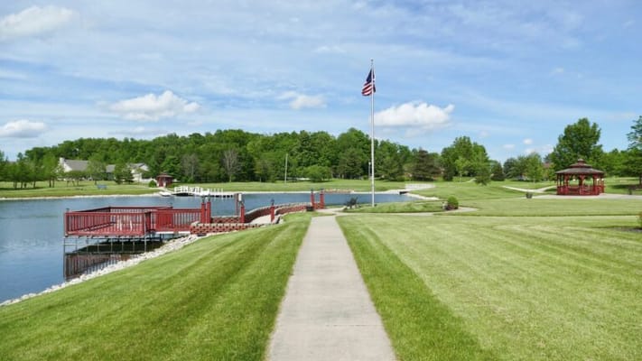 Serene outdoor view of a landscaped area with a pond