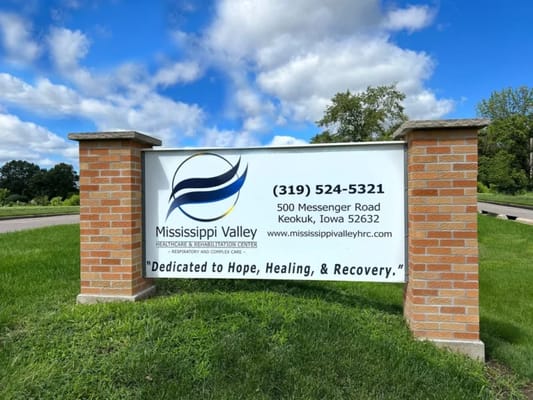 Facility sign with name and contact information