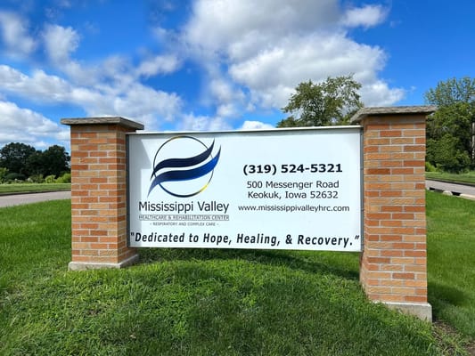 Facility sign with name and contact information