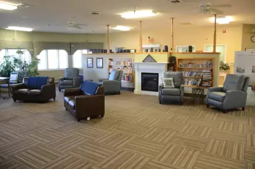 Interior view of a cozy common area with seating