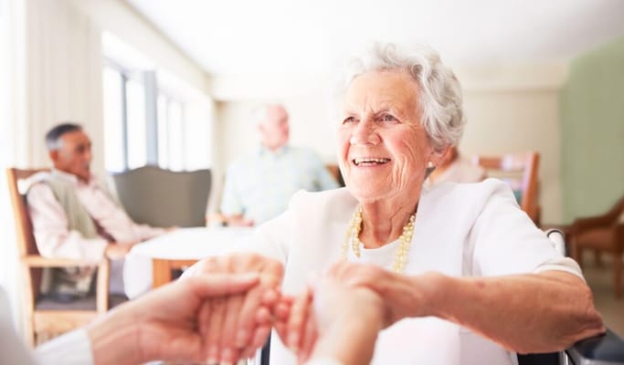 Residents engaging in conversation and smiling