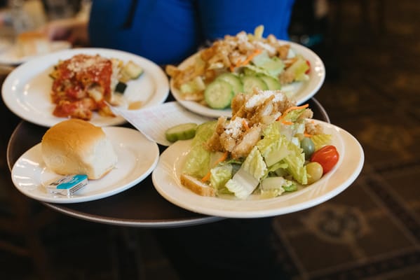 A tray with multiple meals served in a dining area