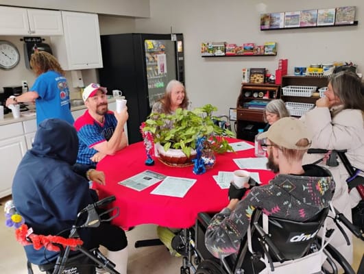 Residents enjoying coffee in a shared lounge area