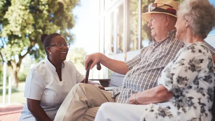 Residents enjoying conversation on a sunny porch