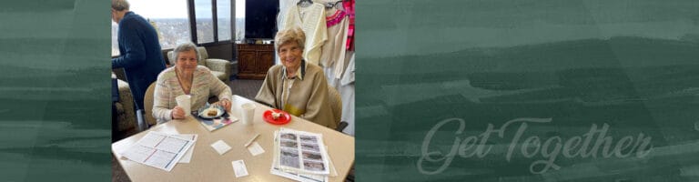 Two residents enjoying coffee in a common area