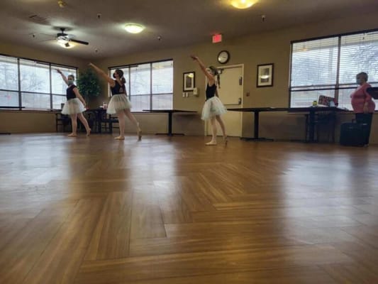 Residents enjoying a dance performance in the common area