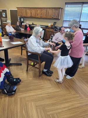 Residents engaged in a dance activity