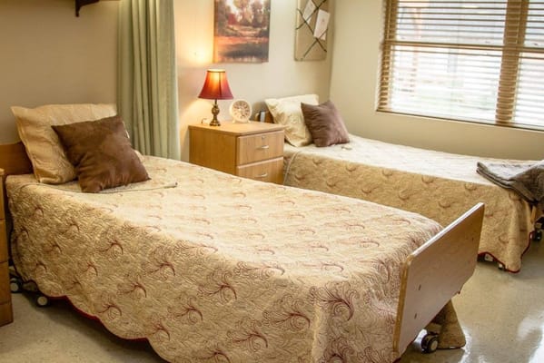 Cozy shared bedroom with two beds and warm lighting