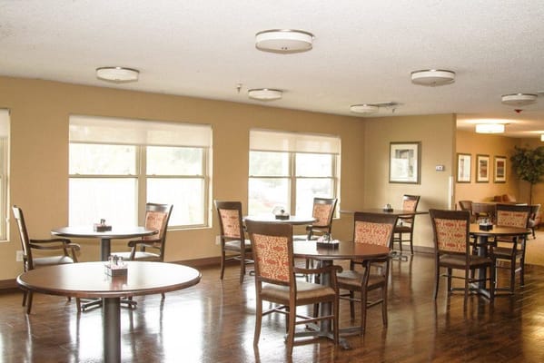 Bright dining area with tables and chairs