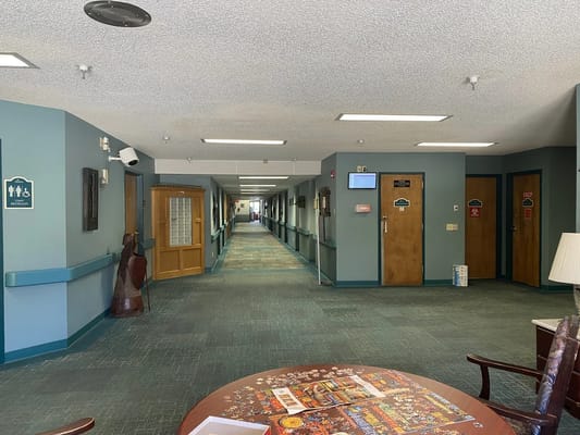 Bright corridor with resident activity tables