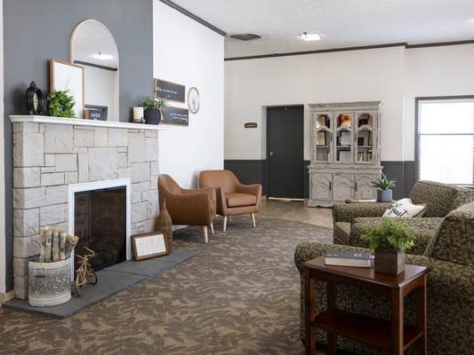 Cozy common area with seating and a fireplace