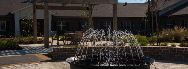 Outdoor fountain in a landscaped courtyard