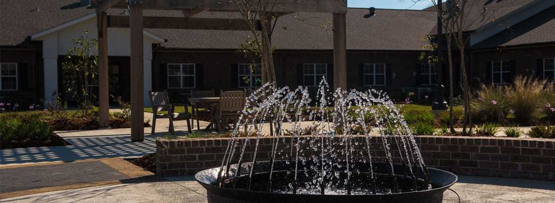 Outdoor fountain in a landscaped courtyard