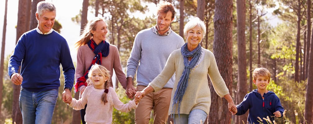 Families enjoying a walk in a wooded area