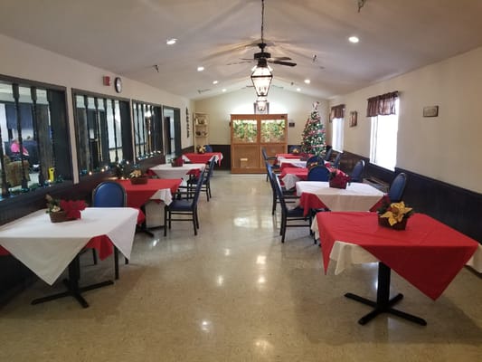Dining area with festive decorations and tables