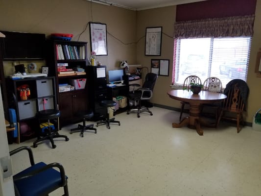 An interior view of a small common area with furniture