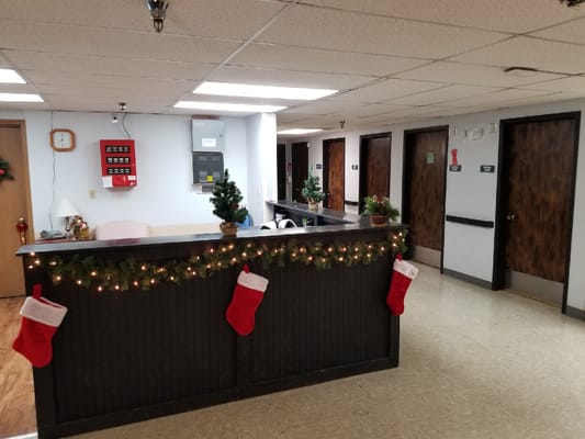 Decorated reception area with stockings and holiday decor