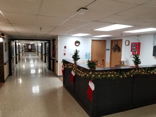 Decorated hallway with holiday decor and reception area