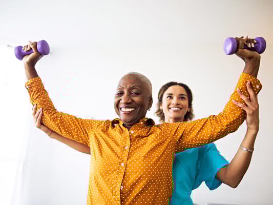 Residents participating in a fitness activity with weights