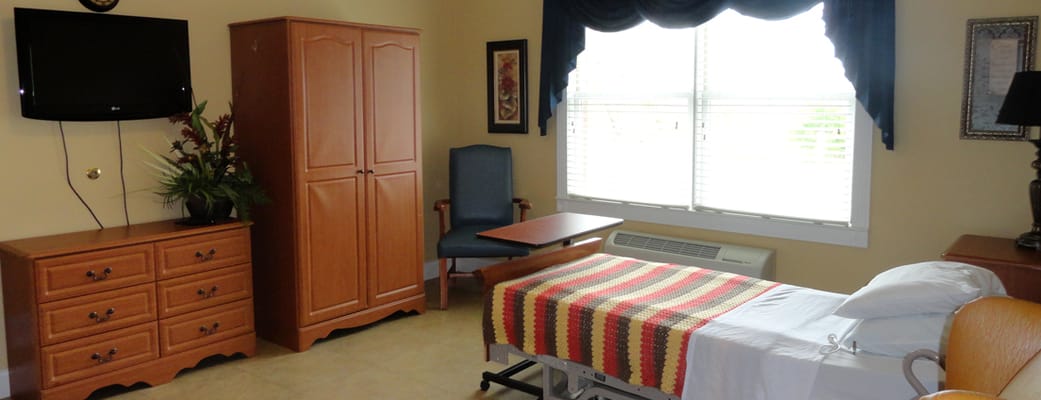 Private resident room with a bed and furniture