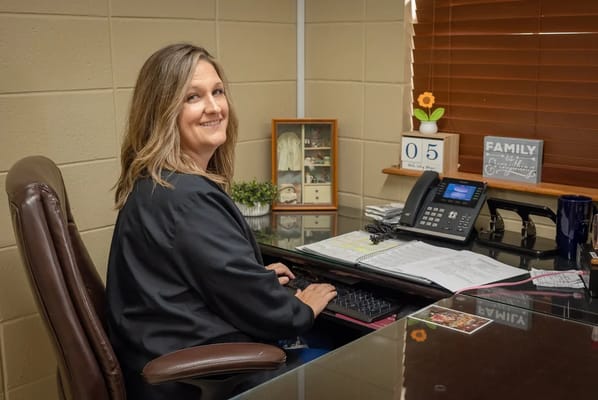 Staff member at desk in an office setting