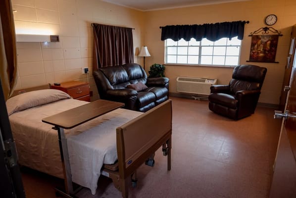 Cozy resident room with bed and seating area