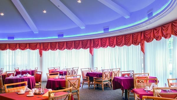 Dining area with round tables and vibrant decor