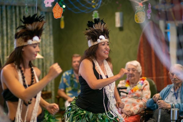 Residents watching a live performance during a celebration