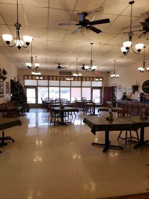 Bright dining area with tables and holiday decorations