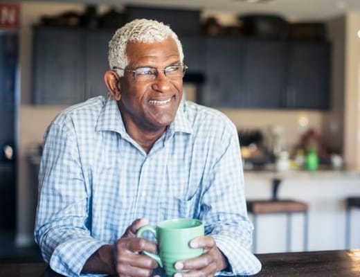 Senior man enjoying coffee in a cozy interior