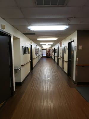 A long corridor decorated for the holidays