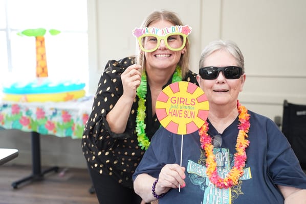 Residents enjoying a festive celebration with props
