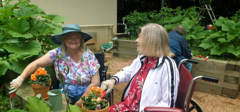 Residents gardening in a vibrant outdoor space