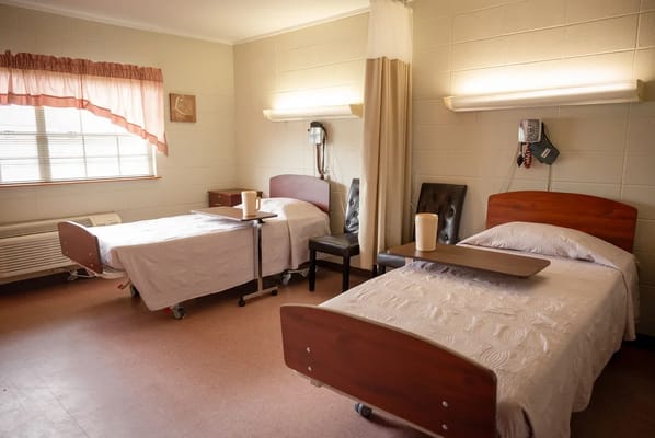 Interior view of a resident room with two beds