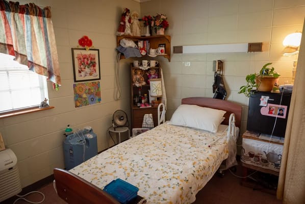 Cozy private room with personalized decorations and a bed