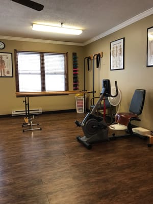 Fitness equipment in a well-lit exercise room